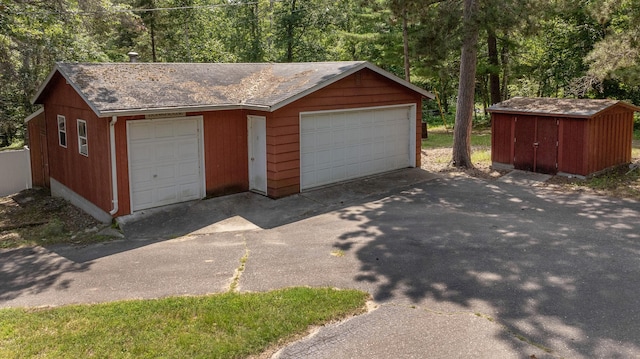 36722 Birch Dr, Jenkins Twp, MN 56474 - detached garage featuring a wooded view