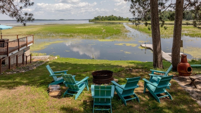 36722 Birch Dr, Jenkins Twp, MN 56474 - view of grassy yard with a fire pit and a deck with water view