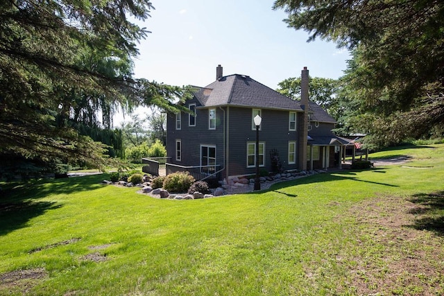 37437 State Highway 7, Big Stone Twp, MN 56278 - rear view of house with a yard and a chimney