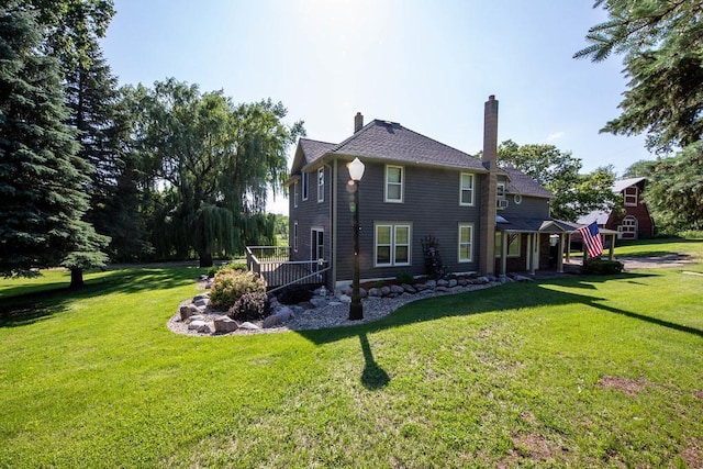 37437 State Highway 7, Big Stone Twp, MN 56278 - rear view of house with a yard and a chimney