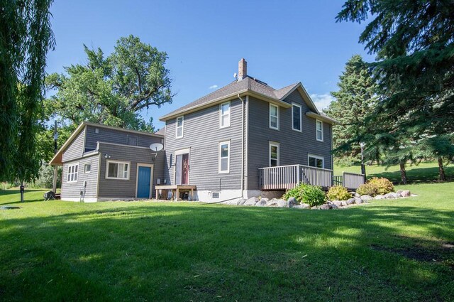37437 State Highway 7, Big Stone Twp, MN 56278 - back of property featuring a chimney, a lawn, and a wooden deck