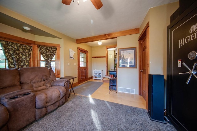 37437 State Highway 7, Big Stone Twp, MN 56278 - carpeted living area featuring a ceiling fan and beam ceiling