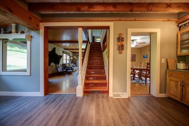37437 State Highway 7, Big Stone Twp, MN 56278 - spare room featuring beam ceiling, wood finished floors, and stairs