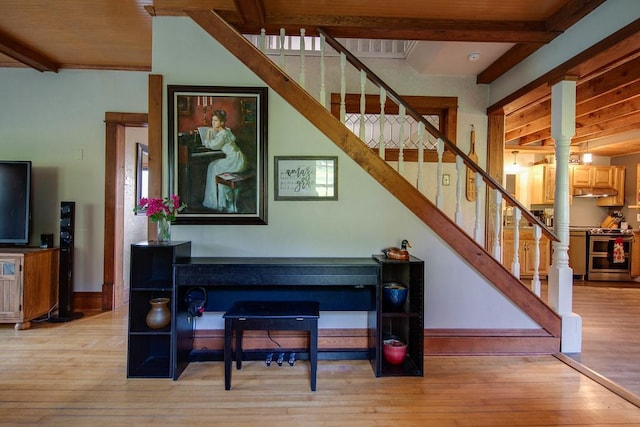 37437 State Highway 7, Big Stone Twp, MN 56278 - staircase with wood finished floors, decorative columns, and beam ceiling