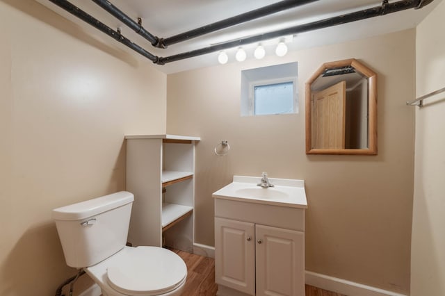 211 Saint Marie St, Duluth, MN 55803 - half bath featuring vanity and wood finished floors