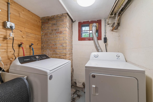 211 Saint Marie St, Duluth, MN 55803 - washroom featuring washing machine and clothes dryer and wood walls