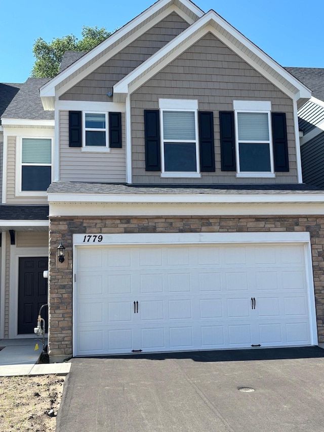 1779 Hauer Trl, Shakopee, MN 55379 - view of front of house with a garage and stone siding