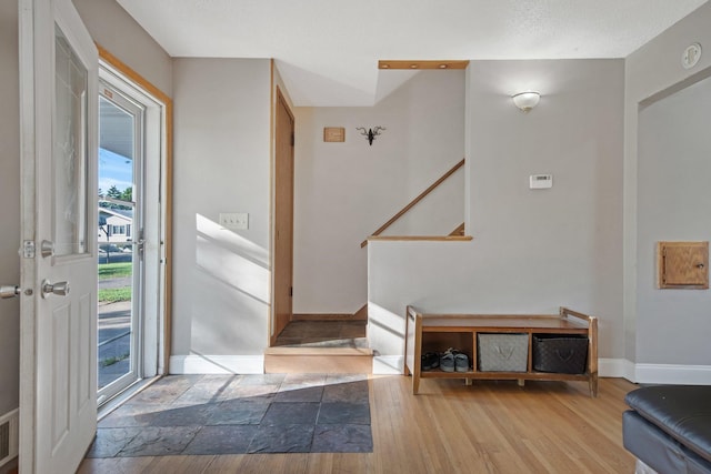 3237 Jerry Ct, White Bear Lake, MN 55110 - foyer entrance featuring healthy amount of natural light, wood finished floors, and stairway