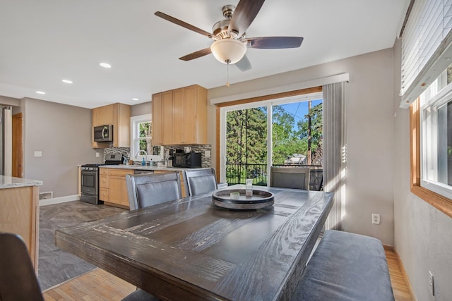 3237 Jerry Ct, White Bear Lake, MN 55110 - dining space featuring ceiling fan, light wood finished floors, and recessed lighting