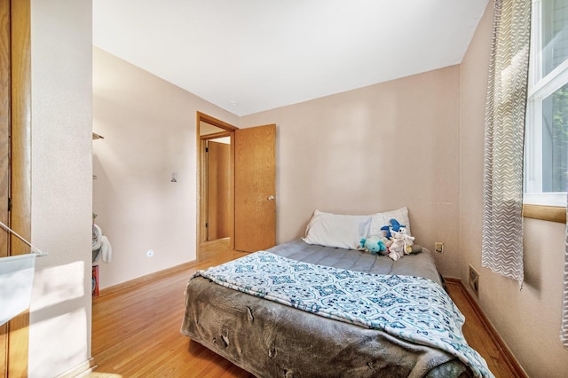3237 Jerry Ct, White Bear Lake, MN 55110 - bedroom with light wood-style flooring and baseboards