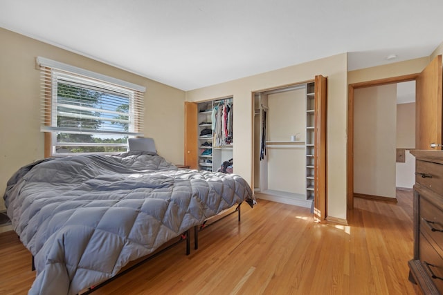 3237 Jerry Ct, White Bear Lake, MN 55110 - bedroom featuring light wood-style flooring and baseboards