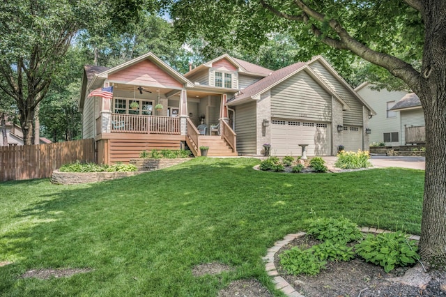 12145 Jonquil St NW, Coon Rapids, MN 55433 - view of front of property with covered porch, a ceiling fan, an attached garage, driveway, and stairway
