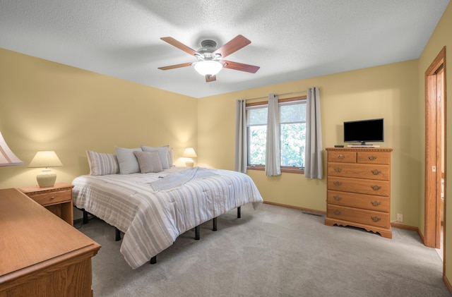 12145 Jonquil St NW, Coon Rapids, MN 55433 - bedroom featuring carpet flooring, a ceiling fan, and a textured ceiling