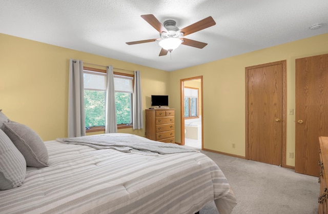 12145 Jonquil St NW, Coon Rapids, MN 55433 - bedroom featuring light carpet, ceiling fan, and ensuite bathroom