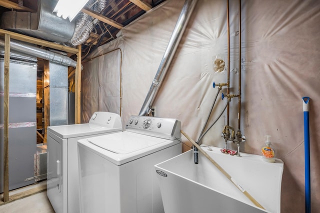 12145 Jonquil St NW, Coon Rapids, MN 55433 - washroom with washer and clothes dryer and heating unit
