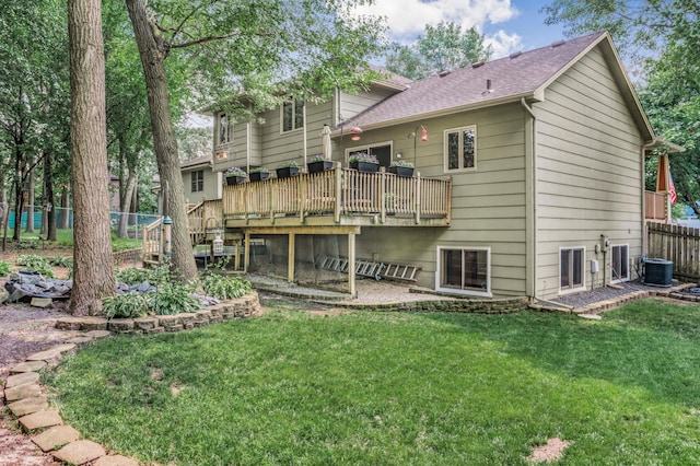 12145 Jonquil St NW, Coon Rapids, MN 55433 - rear view of house featuring a wooden deck and roof with shingles