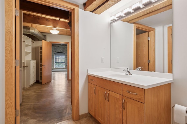 404 Washington Ave N Unit 304, Minneapolis, MN 55401 - bathroom with vanity, beam ceiling, and concrete floors
