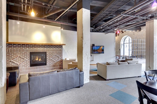 404 Washington Ave N Unit 304, Minneapolis, MN 55401 - carpeted living room with a fireplace and brick wall