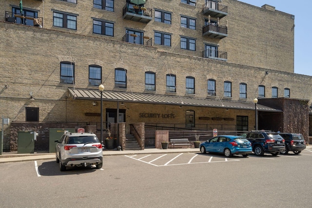 404 Washington Ave N Unit 304, Minneapolis, MN 55401 - view of apartment building / complex featuring uncovered parking