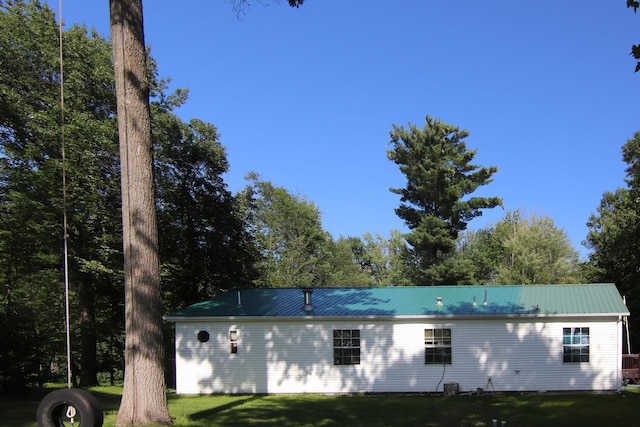 23829 Bulrush Dr, Lake Edward Twp, MN 56465 - view of front of house with a front lawn and a metal roof