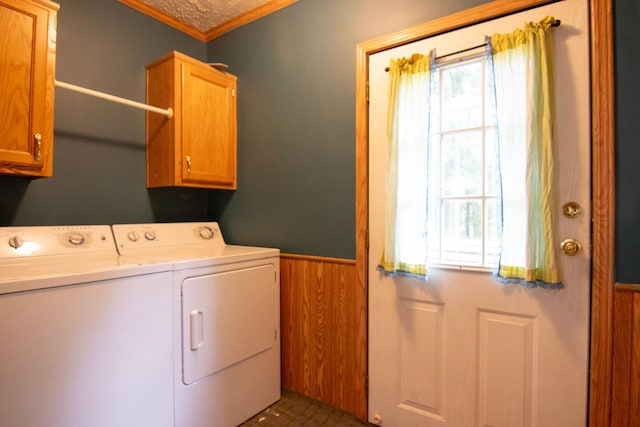 23829 Bulrush Dr, Lake Edward Twp, MN 56465 - laundry room with cabinet space, wainscoting, ornamental molding, washer and clothes dryer, and wooden walls