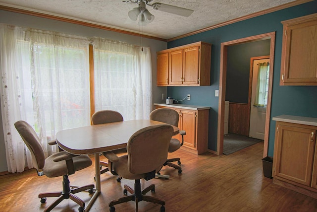 23829 Bulrush Dr, Lake Edward Twp, MN 56465 - dining area with wood finished floors, a textured ceiling, ceiling fan, ornamental molding, and an office area