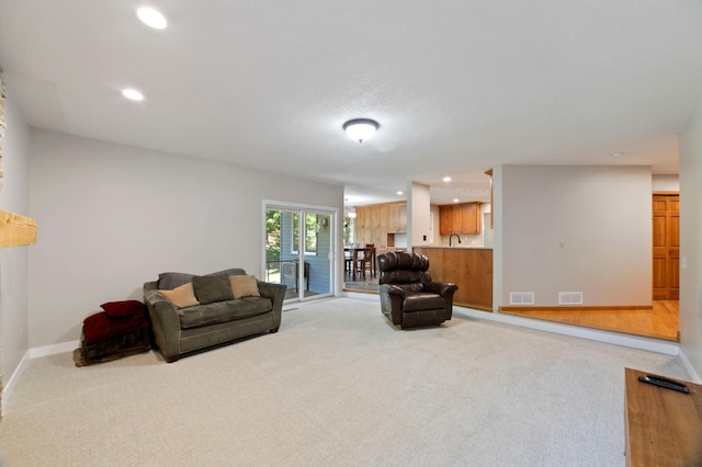 1110 Lecuyer Dr, Stillwater, MN 55082 - living area featuring light colored carpet and recessed lighting