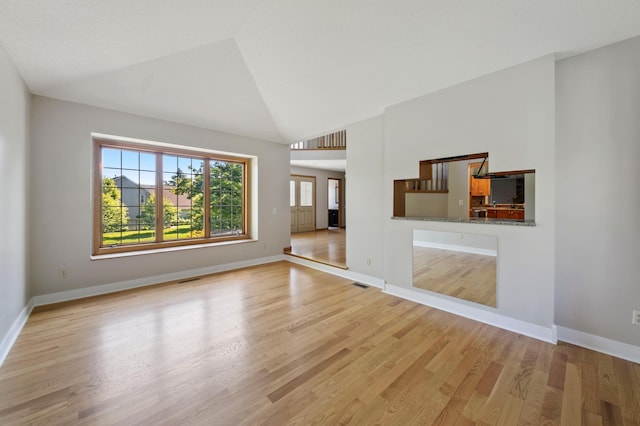 1110 Lecuyer Dr, Stillwater, MN 55082 - unfurnished living room featuring light wood-style floors and high vaulted ceiling