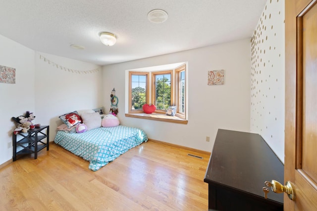 1110 Lecuyer Dr, Stillwater, MN 55082 - bedroom featuring wood finished floors and a textured ceiling