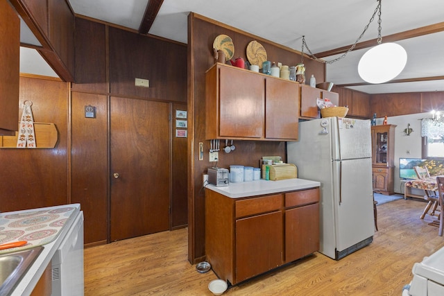 674 Greer Ave NW, Maple Lake, MN 55358 - kitchen featuring white appliances, light countertops, light wood-type flooring, and brown cabinetry