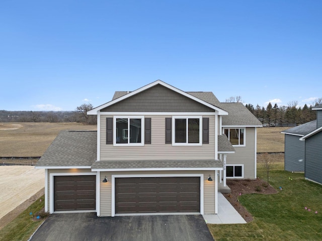 17006 Traprock St NW, Ramsey, MN 55303 - traditional-style home with asphalt driveway, a front yard, roof with shingles, and a garage
