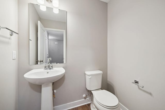 17006 Traprock St NW, Ramsey, MN 55303 - bathroom with baseboards and wood finished floors