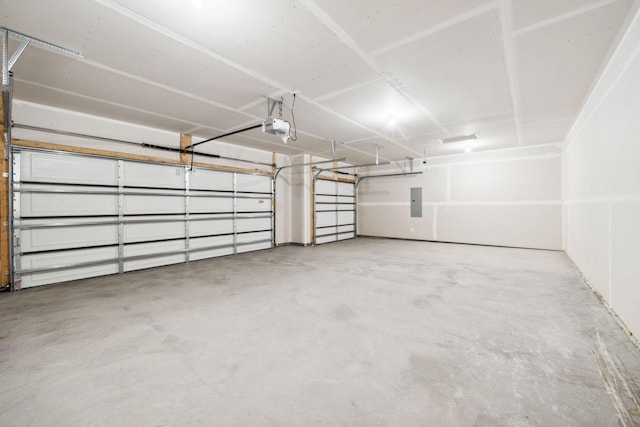 17006 Traprock St NW, Ramsey, MN 55303 - garage featuring a garage door opener and electric panel