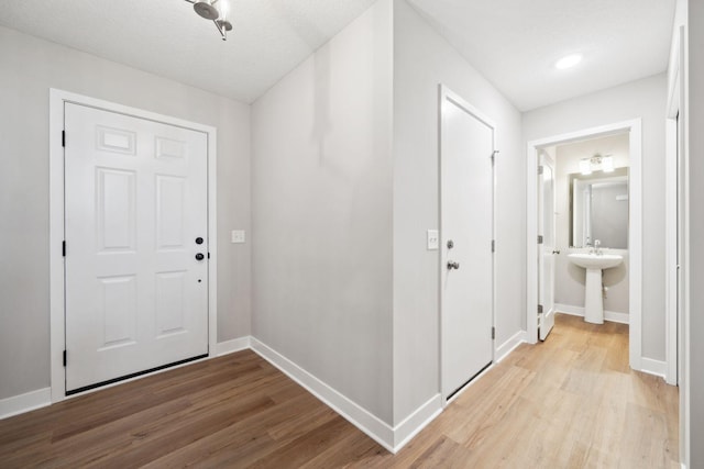 17006 Traprock St NW, Ramsey, MN 55303 - foyer featuring light wood finished floors