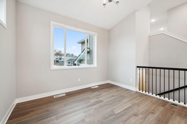 17006 Traprock St NW, Ramsey, MN 55303 - empty room featuring wood finished floors and baseboards