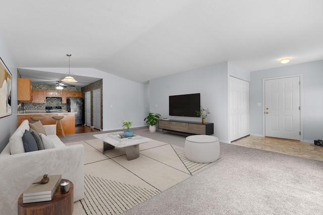 3204 49th St NW, Rochester, MN 55901 - living area featuring lofted ceiling, light colored carpet, and a ceiling fan