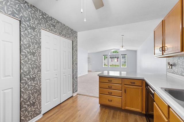 3204 49th St NW, Rochester, MN 55901 - kitchen with wallpapered walls, lofted ceiling, dishwasher, a peninsula, and a ceiling fan