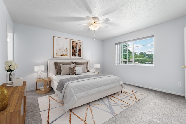 3204 49th St NW, Rochester, MN 55901 - carpeted bedroom with a textured ceiling and a ceiling fan