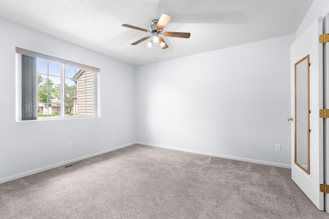 3204 49th St NW, Rochester, MN 55901 - carpeted empty room featuring ceiling fan and a textured ceiling