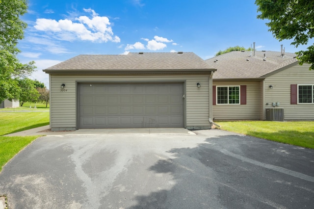 3204 49th St NW, Rochester, MN 55901 - ranch-style home with driveway, a front yard, roof with shingles, and an attached garage