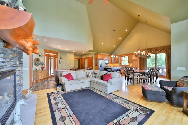2471 Birch Forest Rd SW, Nisswa, MN 56468 - living room with high vaulted ceiling, a chandelier, light wood-style floors, and recessed lighting