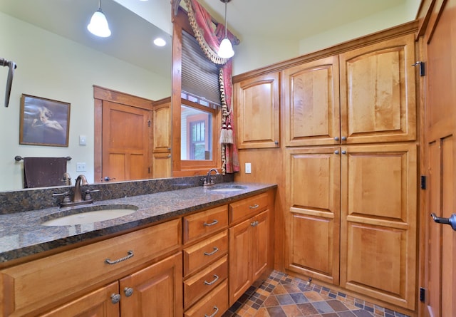 2471 Birch Forest Rd SW, Nisswa, MN 56468 - bathroom with double vanity and tile patterned flooring