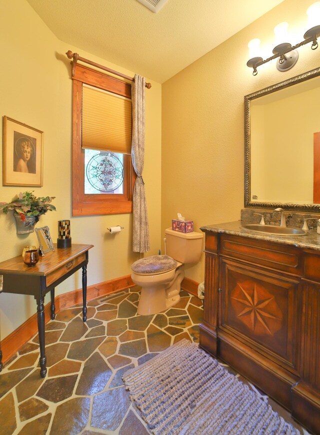 2471 Birch Forest Rd SW, Nisswa, MN 56468 - bathroom featuring stone flooring and vanity