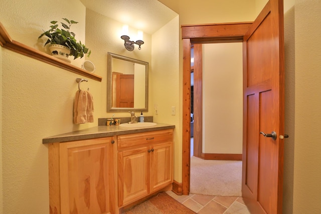 2471 Birch Forest Rd SW, Nisswa, MN 56468 - bathroom featuring vanity and a textured wall