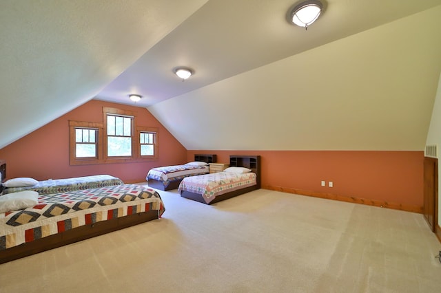 2471 Birch Forest Rd SW, Nisswa, MN 56468 - carpeted bedroom with vaulted ceiling and baseboards