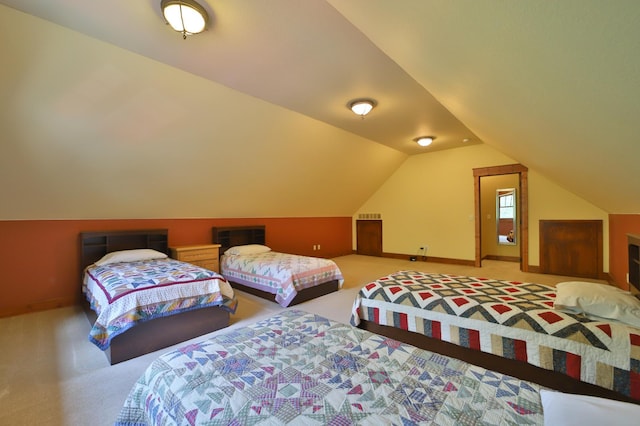 2471 Birch Forest Rd SW, Nisswa, MN 56468 - carpeted bedroom with lofted ceiling and baseboards