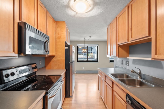 48 Groveland Ter Unit B301, Minneapolis, MN 55403 - kitchen with stainless steel appliances, light wood-style floors, a textured ceiling, open shelves, and pendant lighting