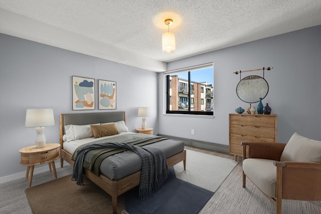 48 Groveland Ter Unit B301, Minneapolis, MN 55403 - carpeted bedroom featuring a textured ceiling and baseboards