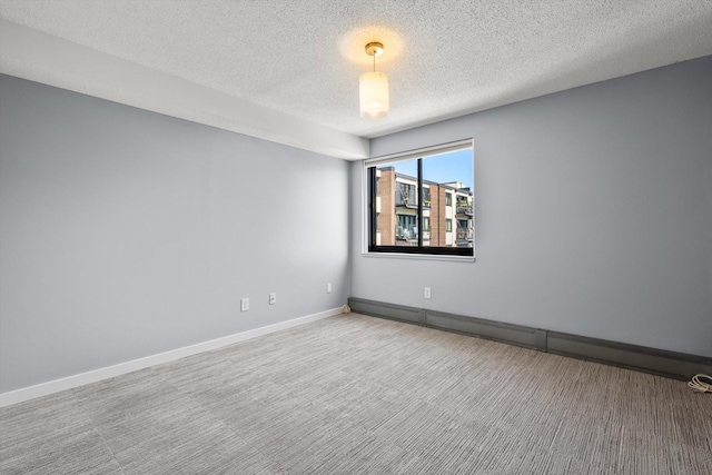 48 Groveland Ter Unit B301, Minneapolis, MN 55403 - carpeted spare room featuring a textured ceiling and baseboards