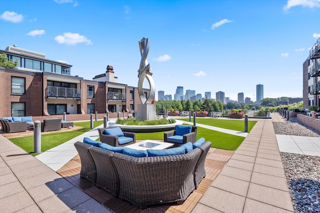48 Groveland Ter Unit B301, Minneapolis, MN 55403 - view of patio with an outdoor living space and a skyline view